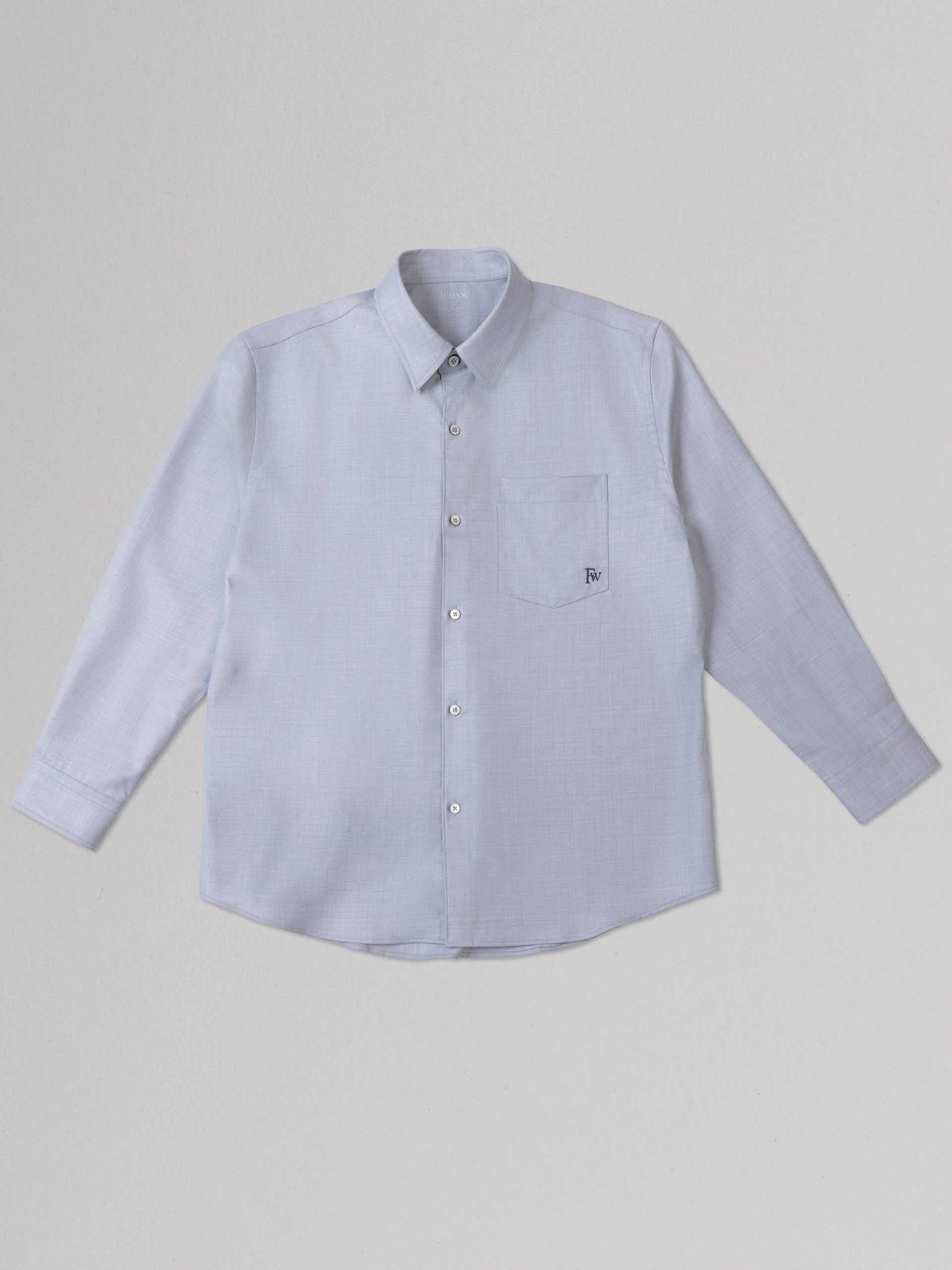 Light blue button-up shirt on a gray background