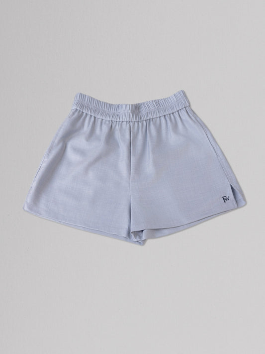 Light blue shorts on a gray background