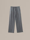 Women's grey heather merino wool straight-leg pant on a neutral sand background.