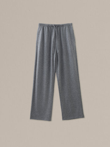 Women's grey heather merino wool straight-leg pant on a neutral sand background.