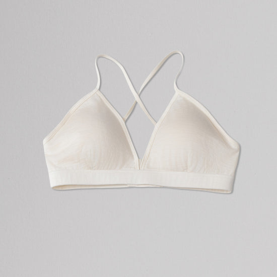 Beige bralette on a gray background